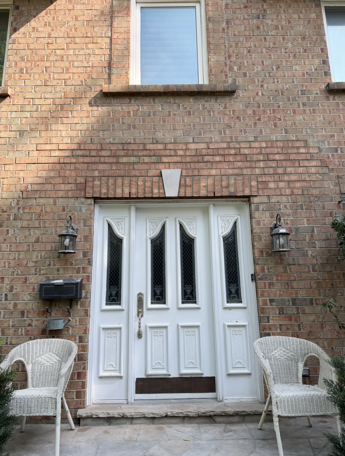 Brick wall and lintel detail above a home entrance
