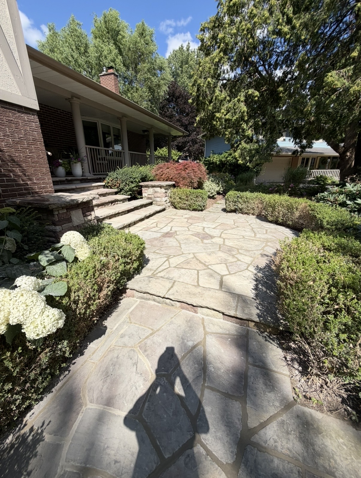Flagstone Walkway — Natural flagstone walkway and steps leading to a front porch.