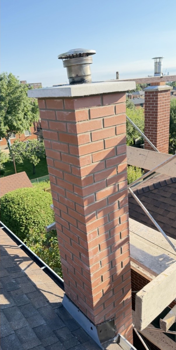 Rebuilt brick chimney with new brick and mortar joints