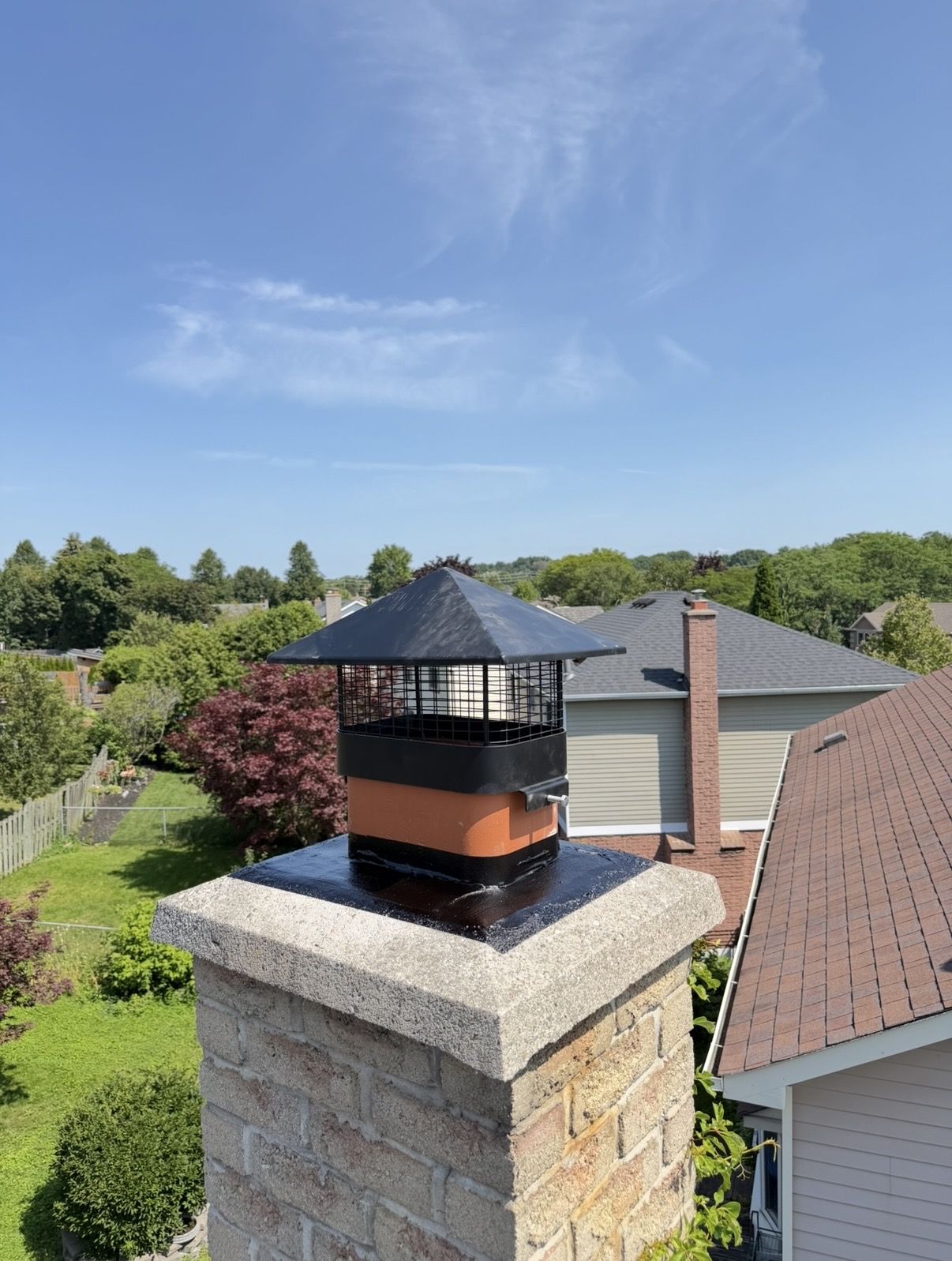 Brick chimney with a sealed crown and new cap